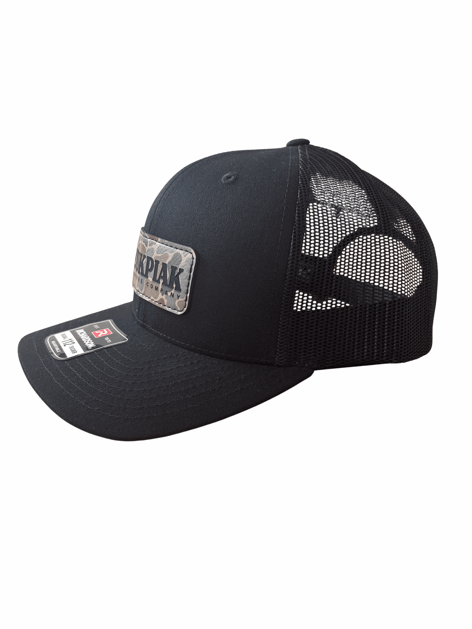 black trucker hat with breathable mesh and kuukpiak coffee patch