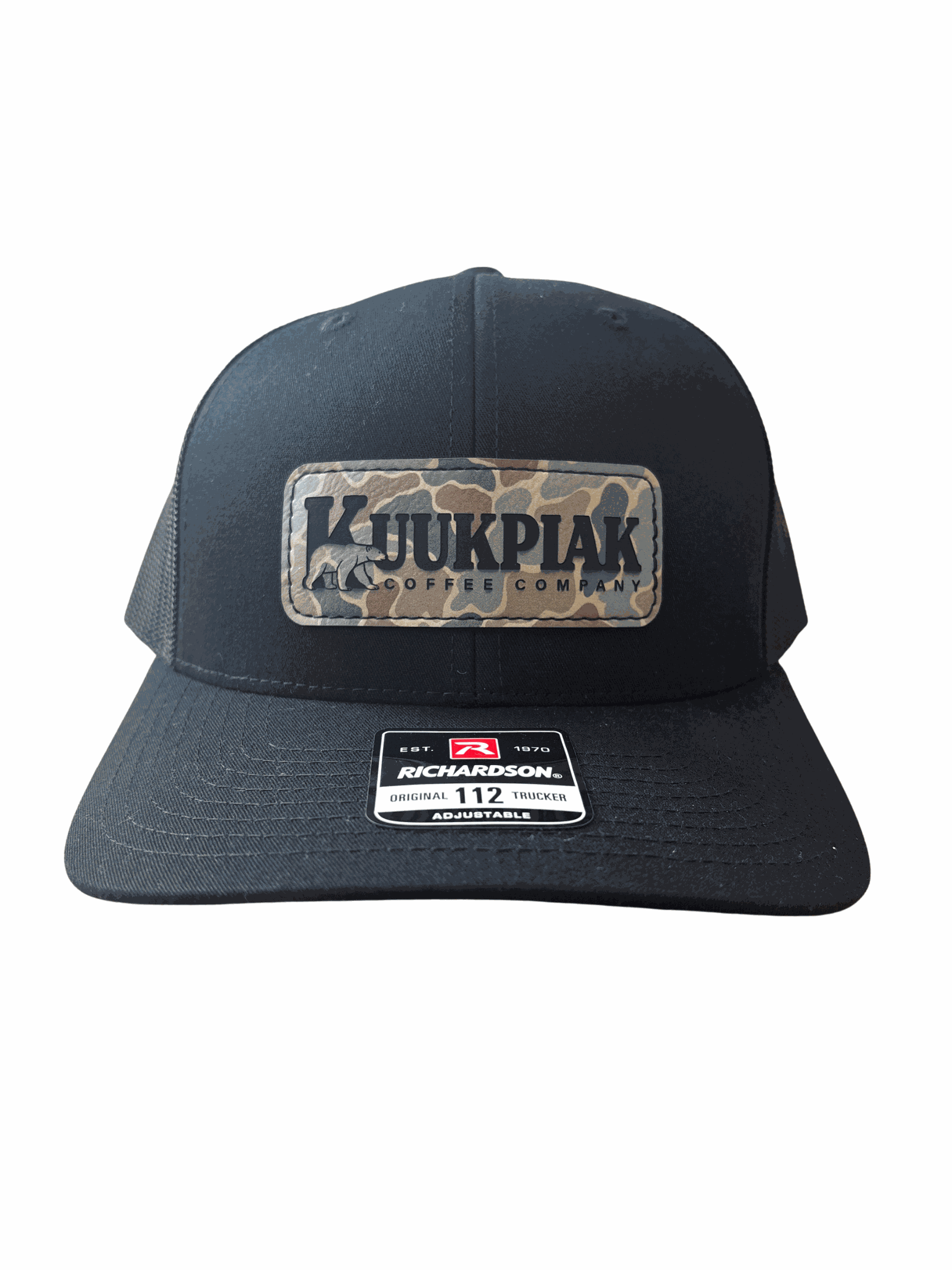 black trucker hat with breathable mesh and Kuukpiak Coffee patch