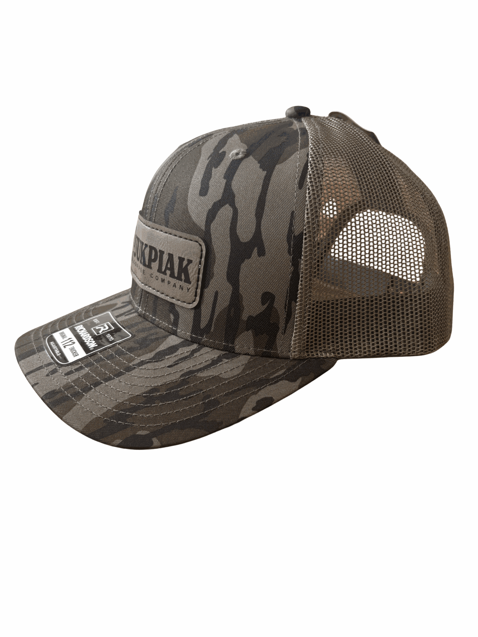 Mossy Oak Bottomland Hat with camo pattern and Kuukpiak Coffee Company patch